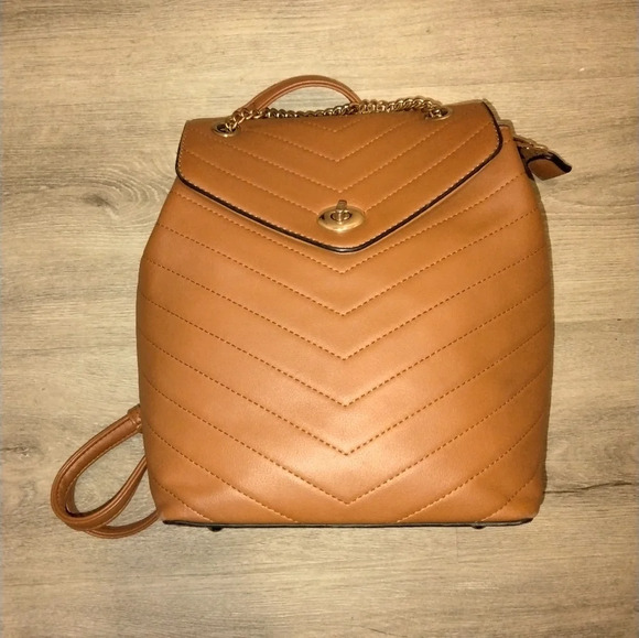 Handbags - Brown small vegan leather backpack with animal print interior EUC